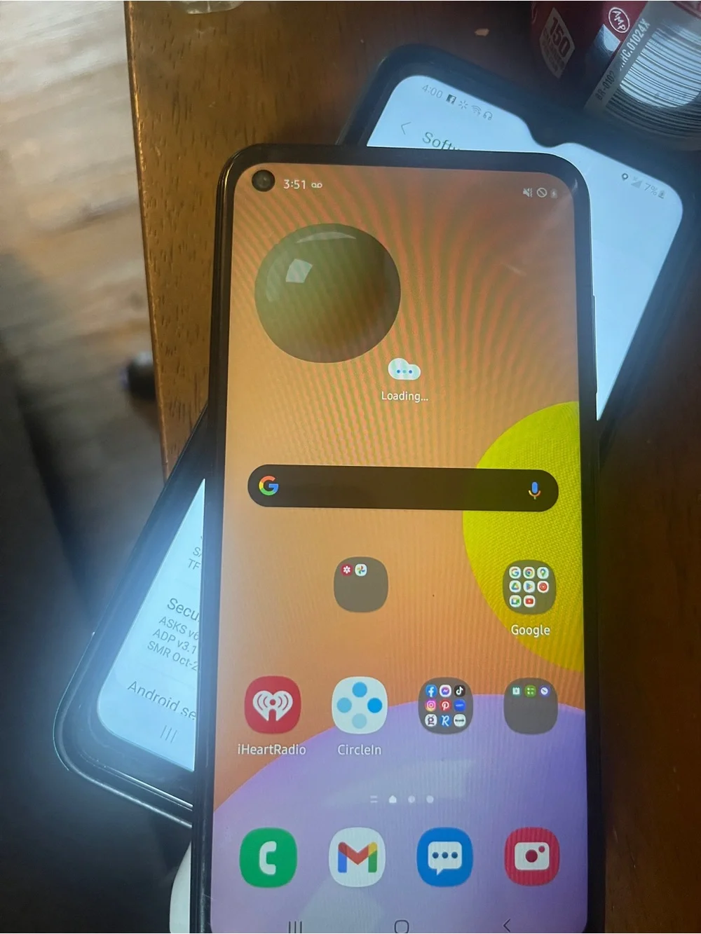 Samsung Smartphone with Black Case and Orange-Purple Home Screen